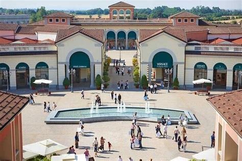 serravalle designer outlet by train.